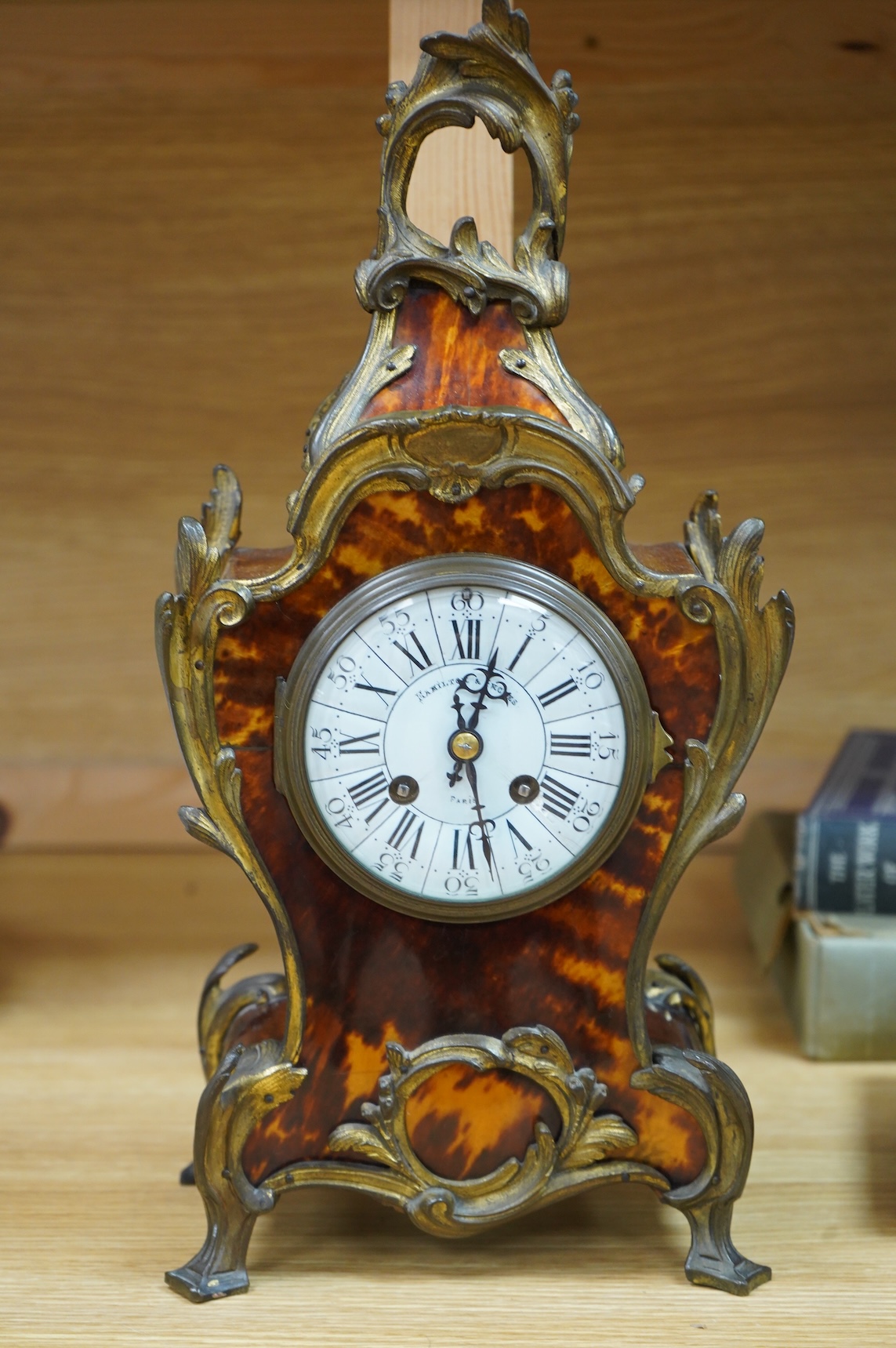 A Louis XV style tortoiseshell and ormolu-mounted mantel clock with pendulum and key, the dial inscribed Hamilton & Inches, Paris, 41cm high